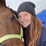photo of Maddie hugging and posing with a horse